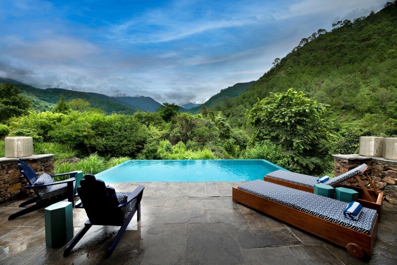 View of the mountains and infinity pool from Punakha River Lodge in Bhutan.jpg
