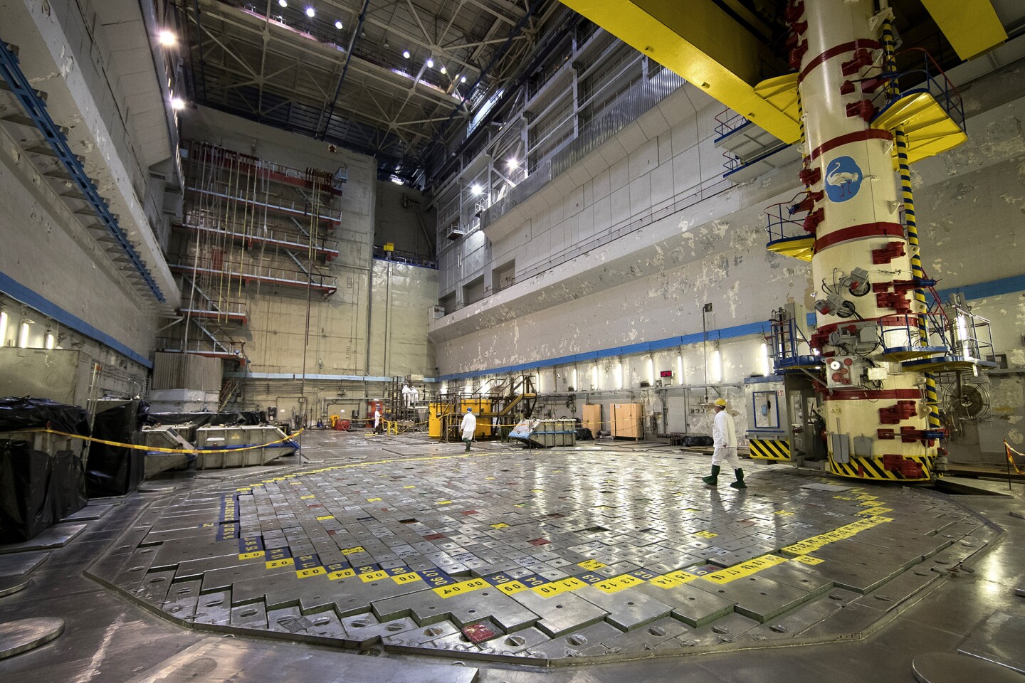 A worker walks on Reactor 1 of the Ignalina nuclear power plant.
