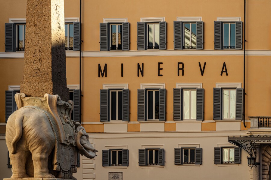 The khaki facade of Orient Express La Minerva in Rome faces elephant obelisk
