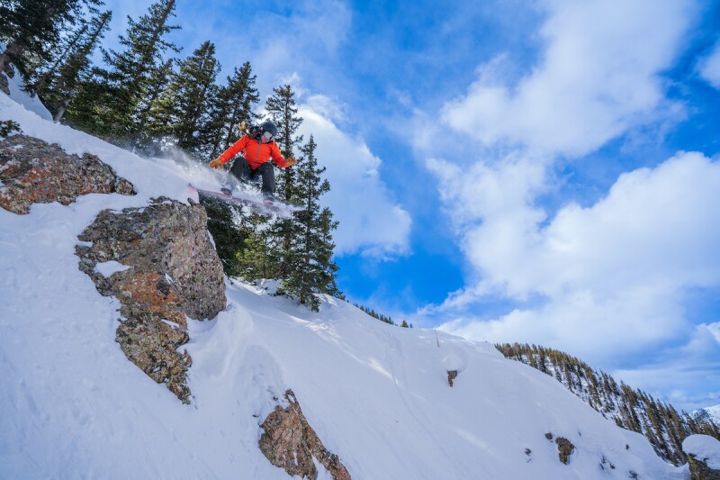 A snowboarder enjoying the slopes at Taos Ski Valley.