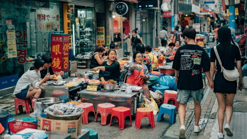 Couple walking in a market and holding hands in Busan, South Korea