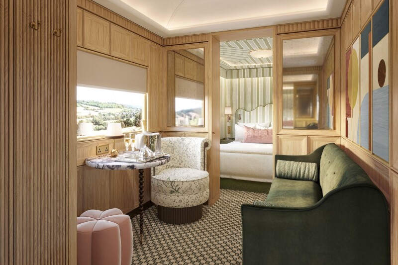 A guest suite with wood-paneled walls, a green couch, a pink ottoman, a marble table, and a bed seen through an open doorway