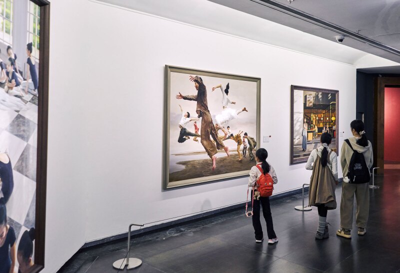 Visitors looking at the Wang YiFan’s, Dream Chasers, center, at the Guangdong Museum of Art
