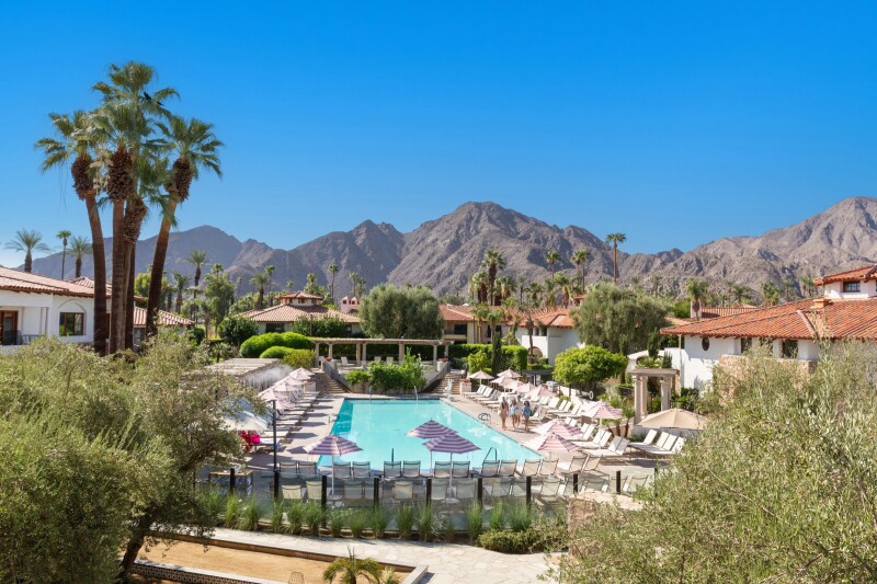 A view of the pool and surrounding desert mountains at Tommy Bahama Miramonte Resort in the Greater Palm Springs, California