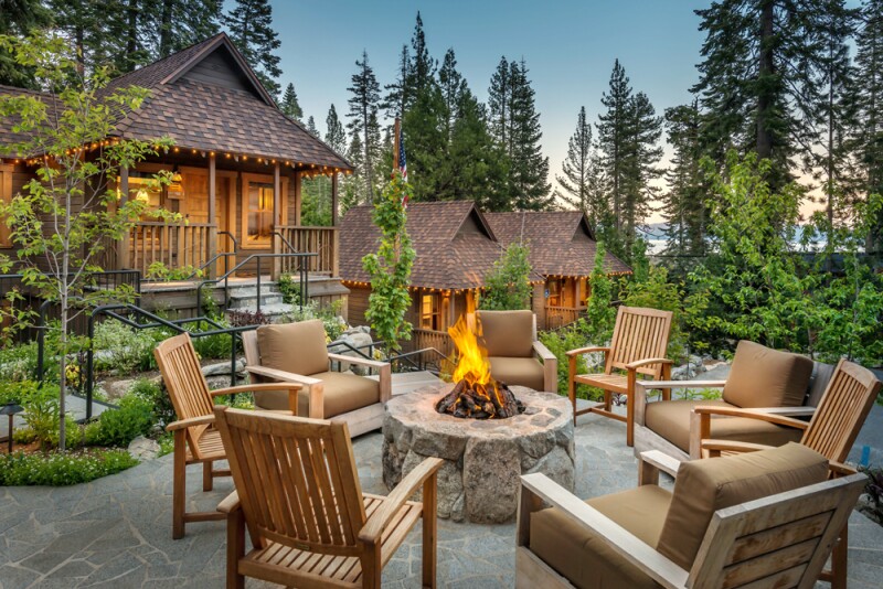 Chairs around firepit outside Cedar Crest Cottages