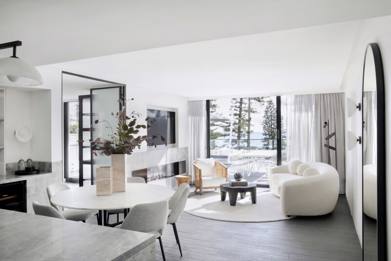 The Infinity Residence at the Manly Pacific is filled with white and neutral-hued furnishings