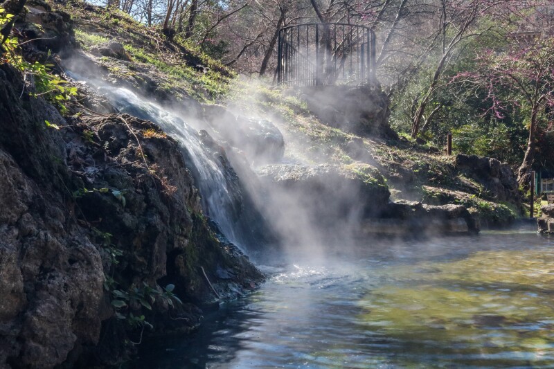 Water rushing over a rocks, with mist