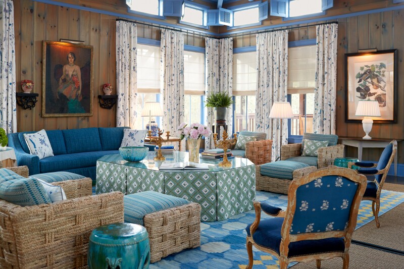 The Blue Room at Lake Austin Spa resort, with blue couches, chairs, and tables, plus curtained windows