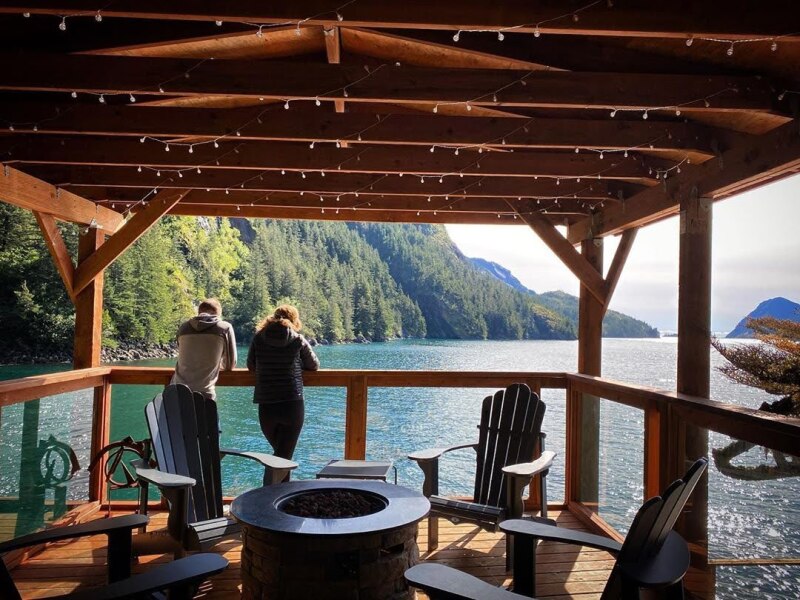 This covered veranda at Orca Island Cabins in Alaska has waterfront views