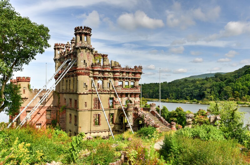 Scottish castle with long metal support beams on island in Hudson River