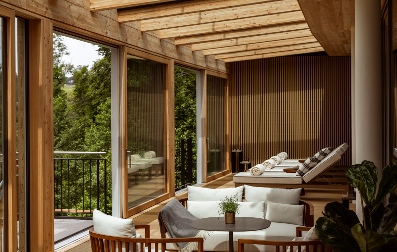 white cushions on chairs and timber roof in a spa setting