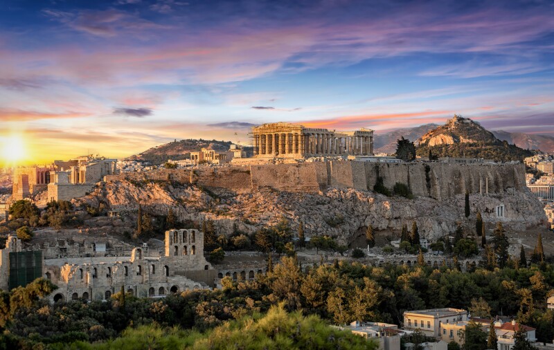 Distant view of the Parthenon Temple at the Acropolis at sunset