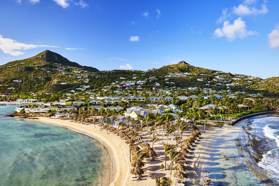 Aerial view of Rosewood Le Guanahani St. Barth, on a secluded peninsula with white-sand beaches.