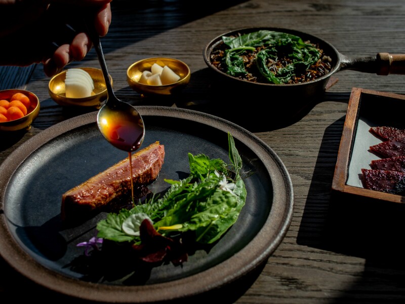 Aged Muscovy duck breast, served with accompaniments, at Restaurant at the Harbor House
