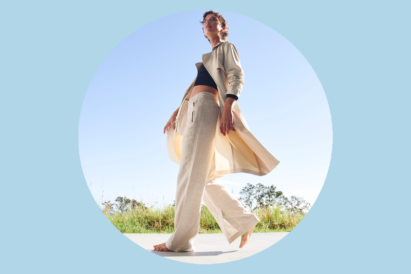 Woman wearing beige linen pants and jacket from Athleta