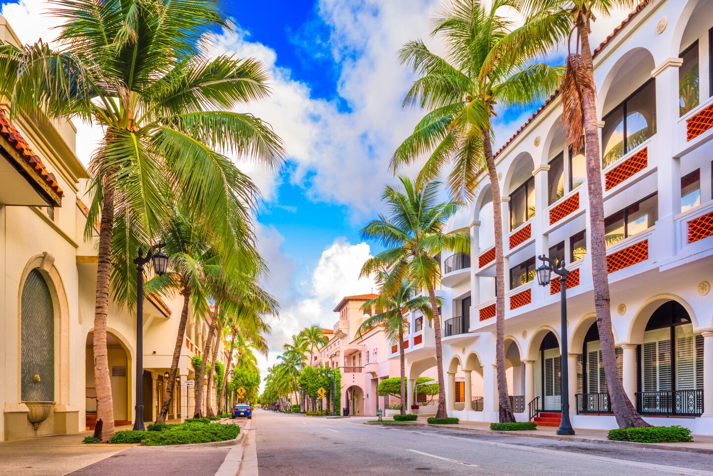 Colorful buildings line a street in the daytime.