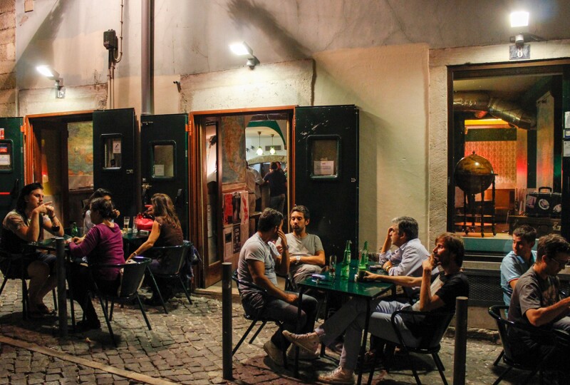 Patrons enjoy the night air outside Maria Caxuxa.