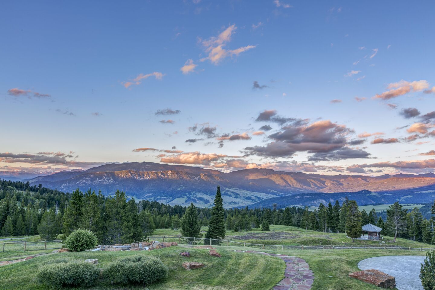 Green field with mountains in the background