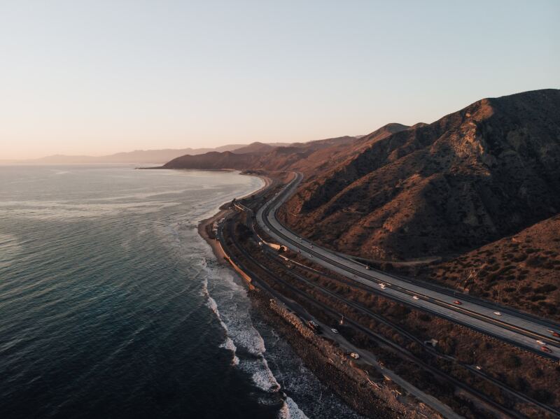 Winding road of Ventura County by the ocean at sunset