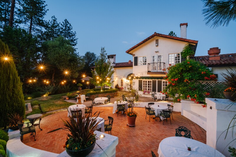 Outdoor dining area of the Elderberry house Restaurant at twilight