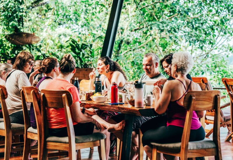 Diners around a table at La Loma Jungle Lodge and Chocolate Farm in Panama