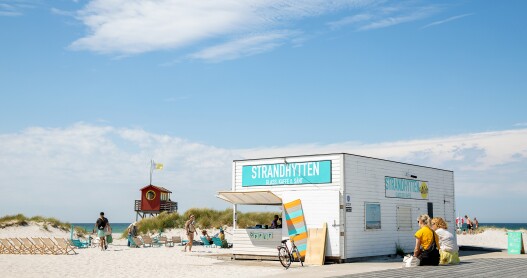 Badhytten ice cream shop with lifeguard tower at beach. Skanör,  Sweden