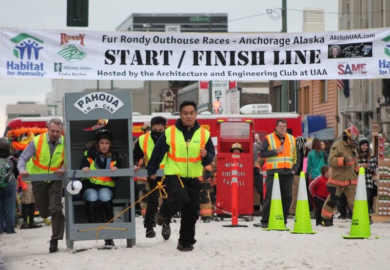 The Outhouse Race sees portable toilets on skis racing along the main drag in downtown.