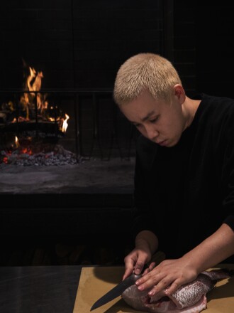 Chef Jonathan Yao filleting a fish