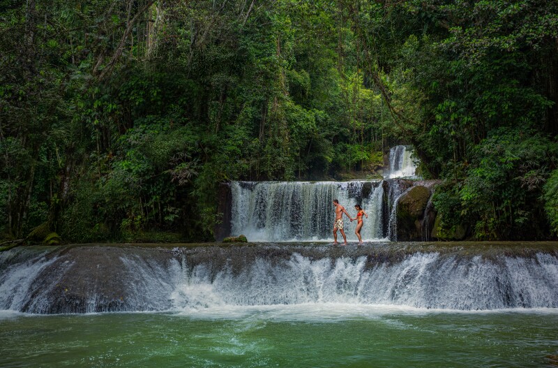 A couple walking along YS Falls