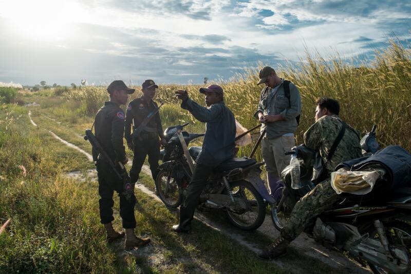 Rangers catch and question a suspected poacher