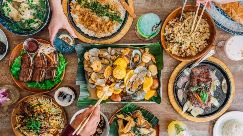 A spread of dishes from Kau Ba Kitchen Houston