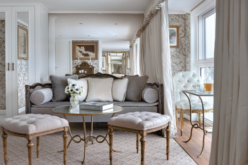 A gray sofa with pillows in a suite on Uniworld's S.S. "Catherine" river cruise ship