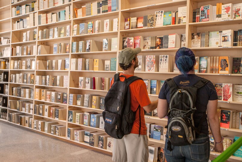 Two people broswing books at Powell's Books in Portland, Oregon