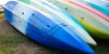 Colorful kayaks in stack