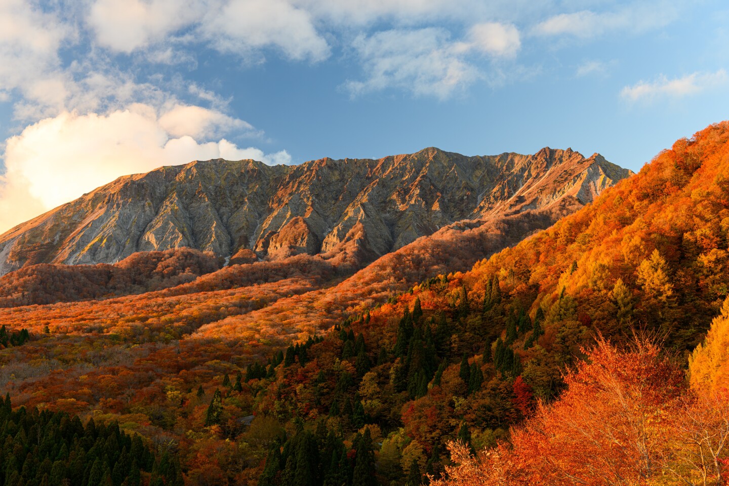 Mount Daisen and autumn leaves in the setting sun seen from Kagikake Pass