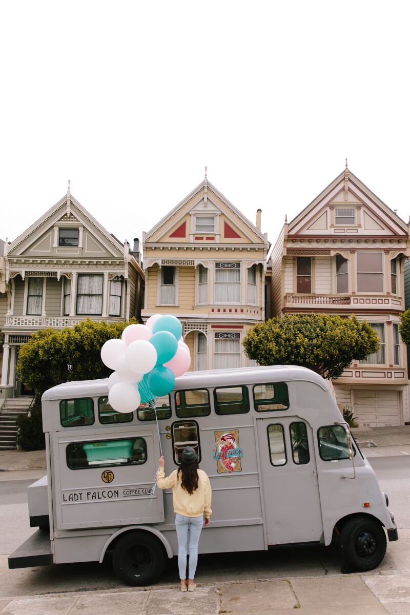 Lady Falcon Coffee Club truck in front of the Painted Ladies in San Francisco