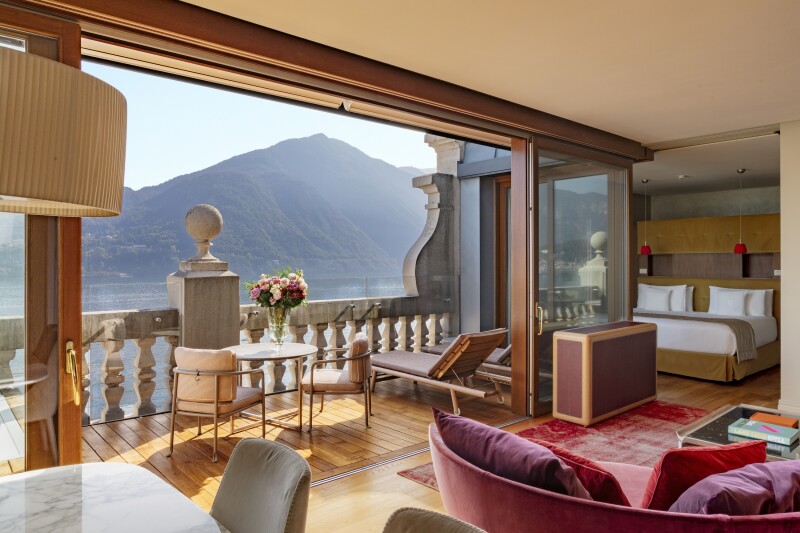 The rooftop suite at Grand Hotel Tremezzo on Italy's Lake Como features a large terrace with a stone balcony that faces the water.