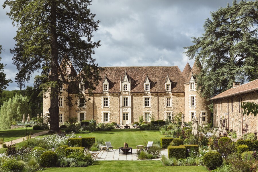 Exterior of three-story Domaine des Etangs, Auberge Resorts Collection, housed in a castle dating back to the 13th century.