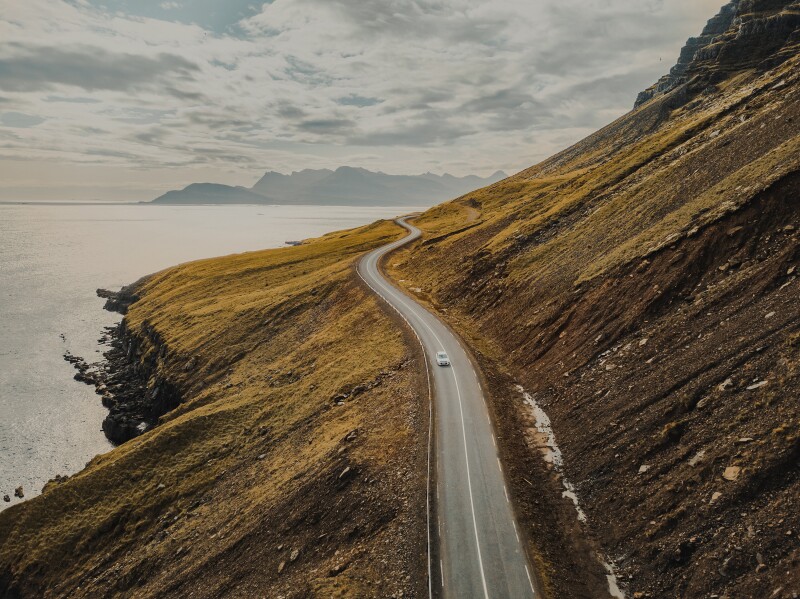 car driving on beautiful road, travel background, aerial scenic landscape from Iceland