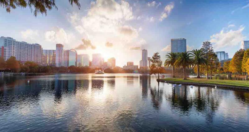 The sun about to break above the Orlando city skyline.
