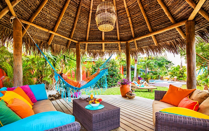 Casitas at the Boardwalk Boutique Hotel feature private patios with hammocks and charcoal barbecues.