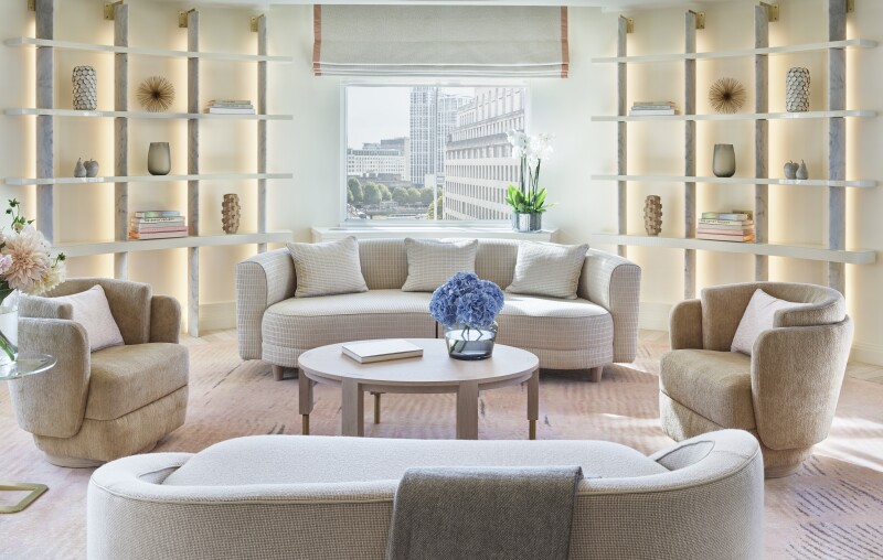 The residential-feeling Somerset Suite at the One Aldwych in London, with curved white sofas and chairs
