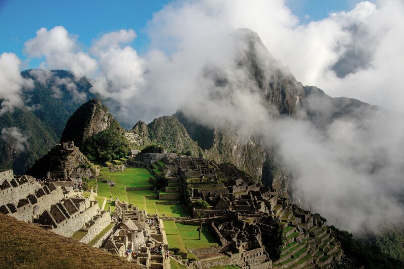 Ancient ruins set on a mountain covered in fog