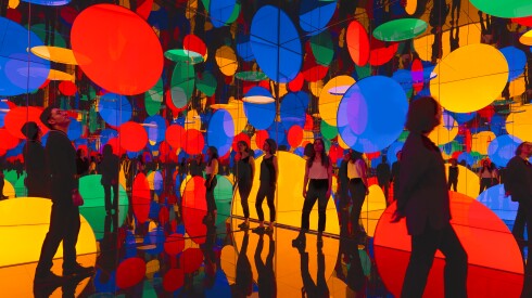 People viewing Dreaming of Earth's Sphericity, I Would Offer My Love, an art installation by Yayoi Kusama