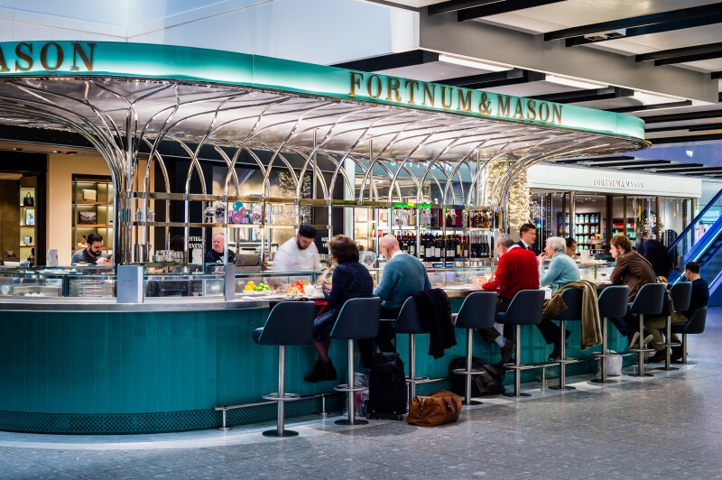 At Heathrow’s Fortnum & Mason Bar, you can order champagne, wine, or a cocktail to go.