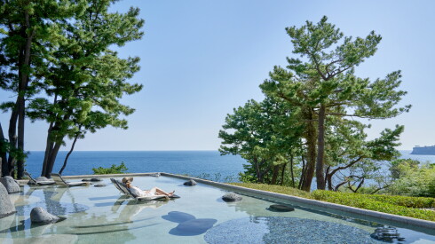 The pool at JW Marriott Jeju Resort & Spa faces the blue horizon of the Korea Strait.