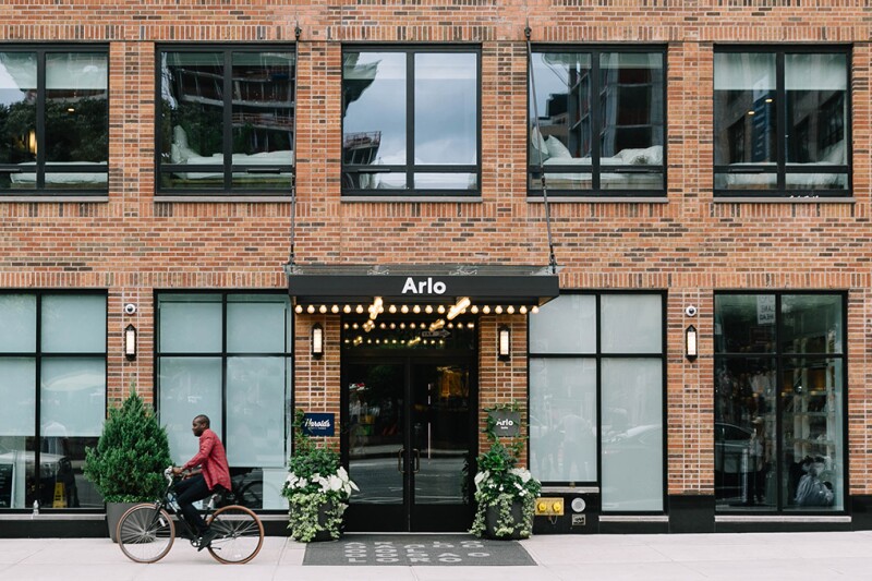 Brick exterior of Arlo SoHo, with rows of large windows